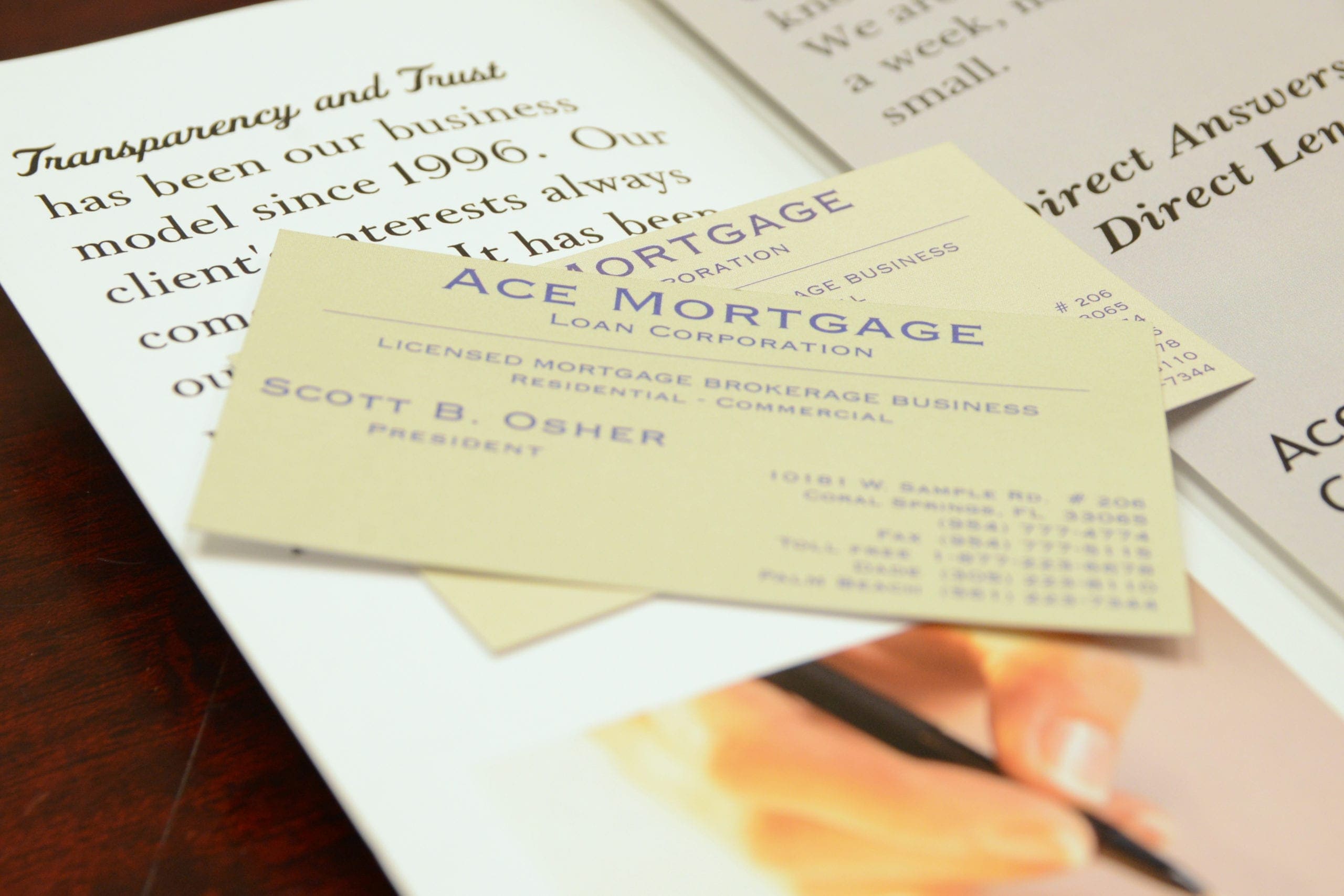 Ace Mortgage business cards on top of documents