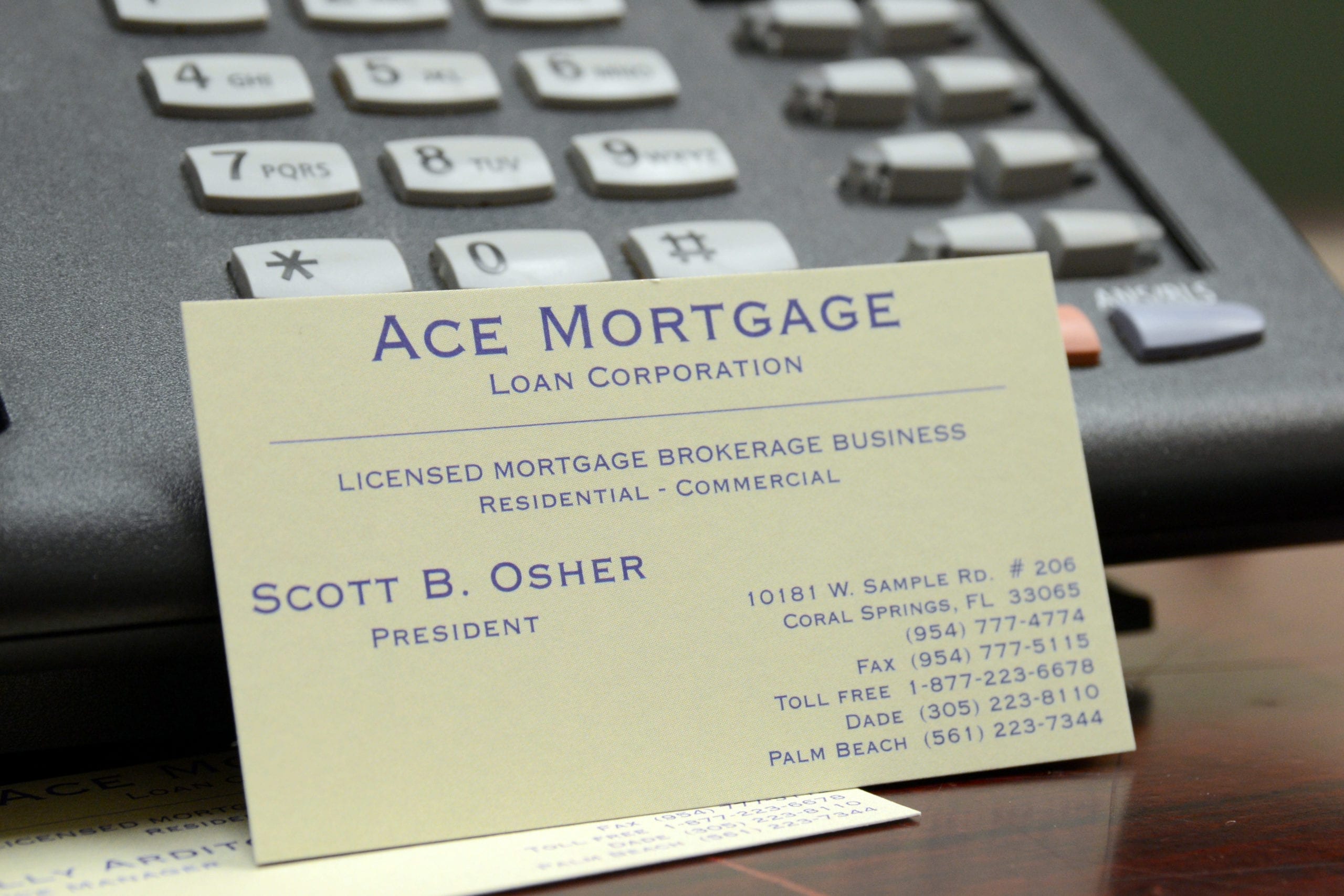 Clients signing mortgage documents with the assistance of a professional advisor.