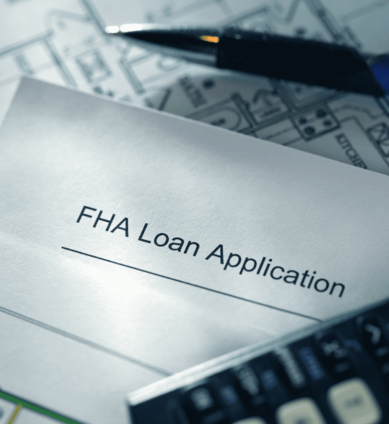 FHA Loan application, calculator, and pen