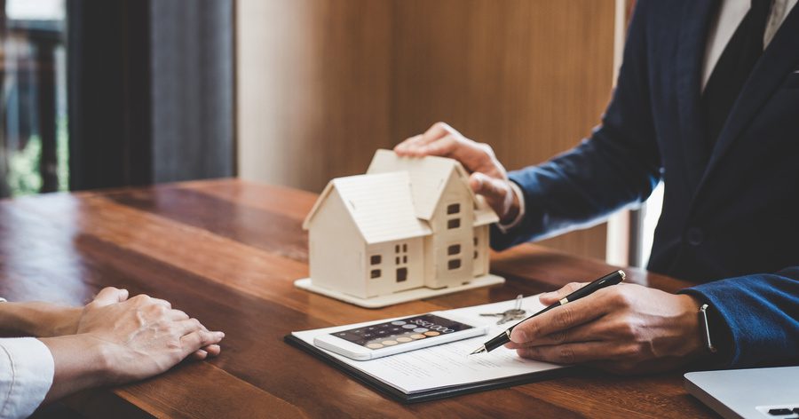 Homeowner discussing home mortgage and loan with agent